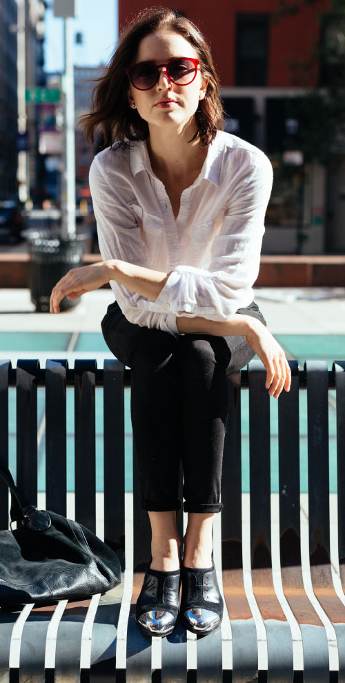 Woman sitting on a city bench